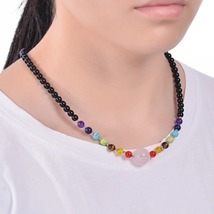 Detailed view of beaded necklace featuring 6mm rose quartz and colorful natural tiger eye stones