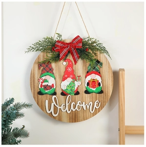 Detail of Christmas wooden welcome sign with three gnomes and festive red plaid bow