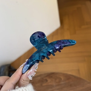 Elegant blue-purple acetate hair claw with gold label for high ponytail and half-up hair