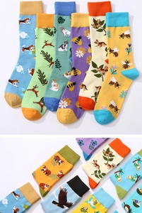 Detailed view of assorted cotton blend crew socks with animal and plant pattern embroidery