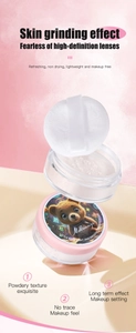 Close-up of Molianji setting powder featuring a cute bear astronaut lid and soft puff