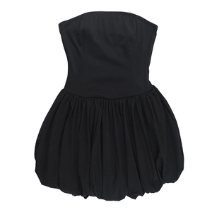 Flat lay of a strapless black bubble dress with a high waist and voluminous mini skirt hem