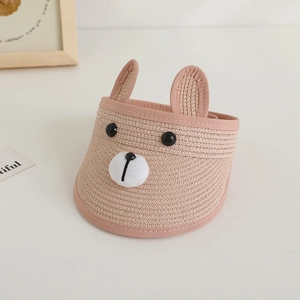 Detailed view of kids cartoon bear straw sun hat with cute ears and breathable weave