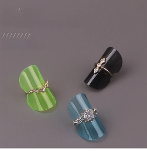 Macro detail of foldable plastic ring display stands in neon green, blue, and black