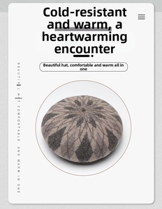 Detail of knitted wool beret showing grey geometric rhombic pattern and soft texture
