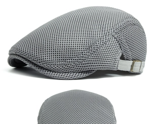 Detail view of breathable grey mesh beret hat featuring an adjustable metal side buckle