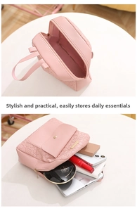 Detailed view of pink embossed leather backpack showing interior storage capacity for tablet