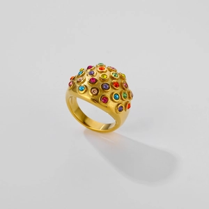 Exaggerated gold bubble dome ring with colorful zircon stones on a white background