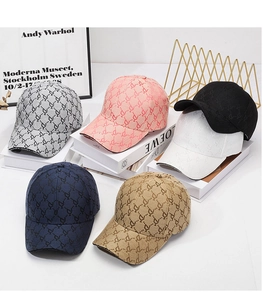 Detail view of stylish jacquard baseball caps in six colors on minimalist display