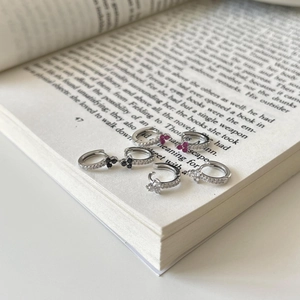 Three pairs of 925 silver mini hoop earrings with red, black, and white zircon flowers