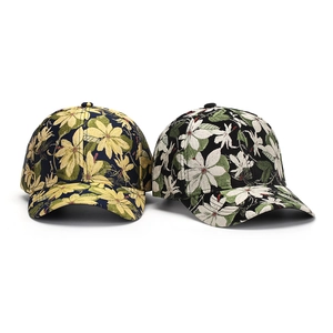 Close-up of floral print patterns on canvas baseball caps with textured jacquard fabric