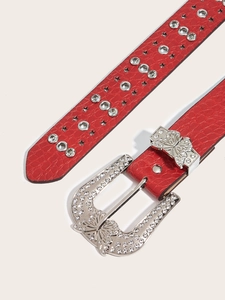 Detail of red crocodile texture belt with silver butterfly rhinestone buckle and stars