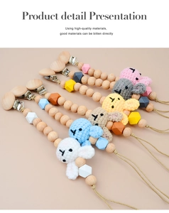 Detail presentation of four crochet rabbit pacifier clips with natural beech wood beads