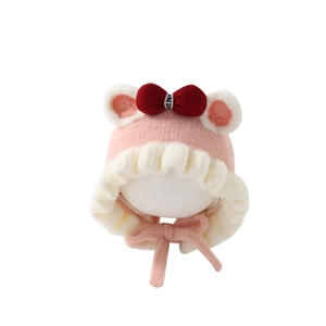 Adorable pink baby girl winter plush hat with red bow and earflaps for warm protection