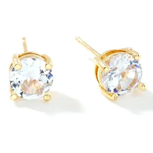 Detailed view of 0.6cm clear cubic zirconia stud earrings in gold-tone claw settings
