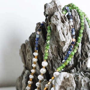 Ethnic style necklace with colorful natural stones, freshwater pearls, and golden beads