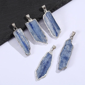 Detailed view of five irregular blue kyanite pendants with silver plated edges and loops
