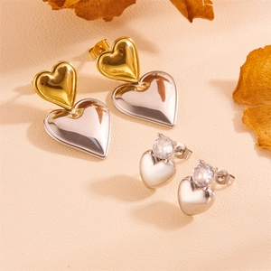 Polished stainless steel heart earrings set with sparkling zircon in gold and silver finish