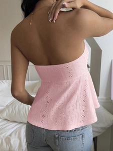 Rear view of pink hollow out embroidery halter top showing open back and slim fit design