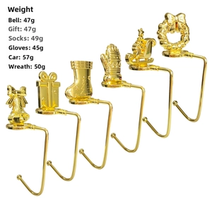 Set of 6 gold Christmas mantle hooks with bells, socks, and sled shapes in shiny finish