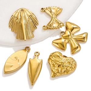 Set of six gold titanium steel pendants in shell, bow, heart, and geometric shapes