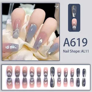 Detail of A619 press-on nails with grey marble design, shell fragments and silver edges