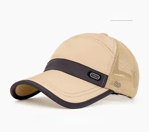 Detail of breathable mesh fabric and rubber logo on the khaki summer quick-dry trucker cap