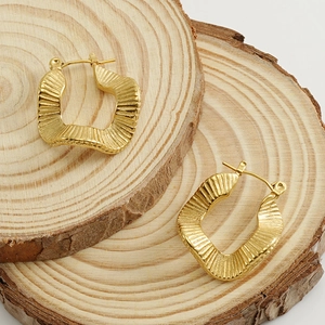 18K gold plated stainless steel hoop earrings with wavy ripple texture in a retro style