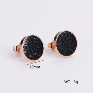 Detailed macro view of 12mm rose gold round stud earrings with black pavé crystals