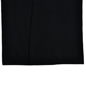 Close-up of high-quality black knitted fabric texture and seamless hem finishing