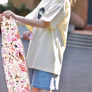 Pink ballet themed stickers shown decorating a longboard skateboard in a lifestyle setting