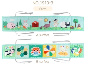 Detailed view of the double-sided baby cloth book with farm animals and geometric patterns