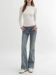 Slim fit white long sleeve crewneck top with vintage washed blue flared jeans