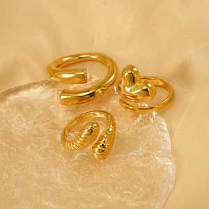 Three-piece 18K gold plated stainless steel ring set with heart and textured designs