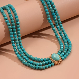 Vintage multilayer turquoise beaded choker with a central green oval gemstone