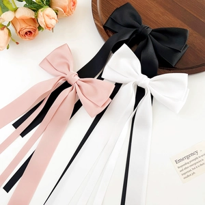 Elegant satin ribbon bow hair clips in pink, white and black colors with long streamers