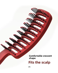 Macro detail of the curved vented hairbrush with boar bristles and massage tips