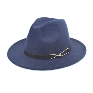 Detailed view of navy blue wool fedora featuring a black leather band and gold buckle