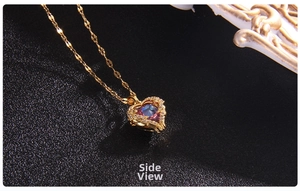 Detailed side view of heart pendant necklace with blue gradient stone and gold chain
