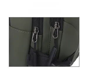 Close-up of smooth dual zippers with extended pull cords on a green crossbody bag