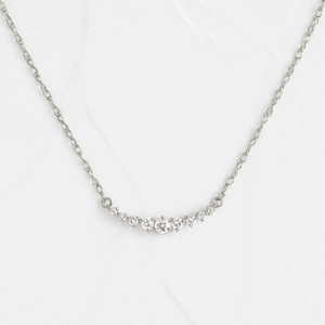 Elegant smile shaped necklace in silver finish with nine sparkling zircon stones