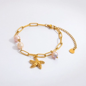 Macro view of 18K gold stainless steel bracelet with starfish pendant and pink pearls