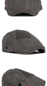 Macro detail of grey herringbone flat cap with adjustable buckle and wool texture