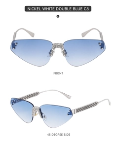 Détail de lunettes de soleil sans monture à dégradé bleu avec pont en strass et branches en métal