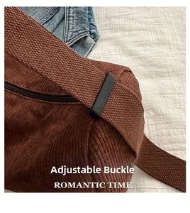 Close-up of adjustable buckle and wide shoulder strap on brown corduroy tote bag