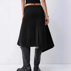 Back view of high waist asymmetric slit midi skirt with zipper detail and leather boots