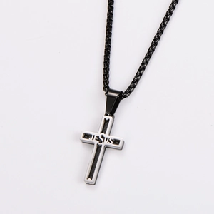 Detail of silver cross pendant with black JESUS engraving and box chain necklace