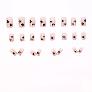 Nude pink press-on nails with black star patterns and glitter details, 24 piece set