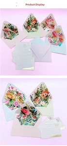 Detail view of 3D pop-up floral greeting card with matching envelope and message card