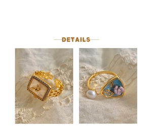 Detailed macro of vintage Baroque pearl ring with blue enamel and floral design details